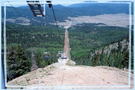 View of Angel Fire Ski Area high-speed quad chairlift.